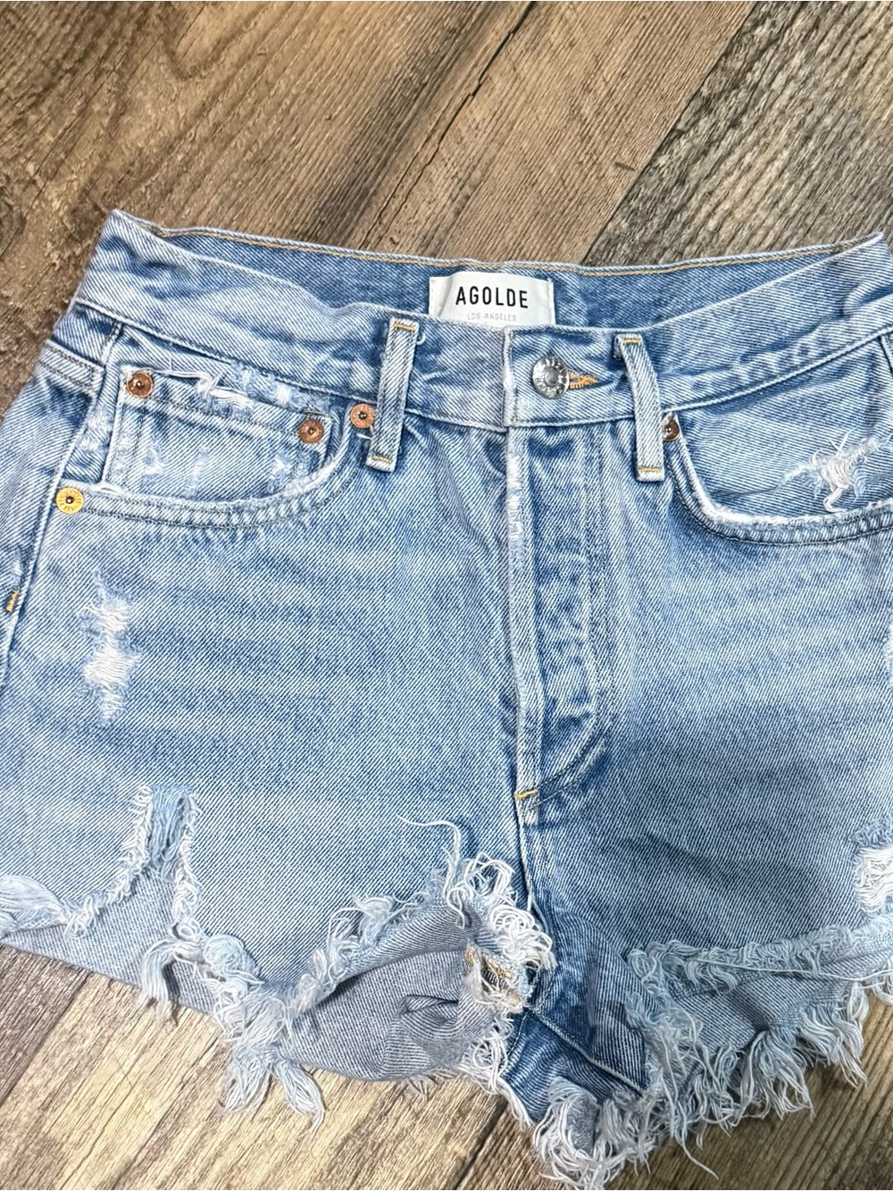 AGOLDE distressed denim cutoff shorts, size 25